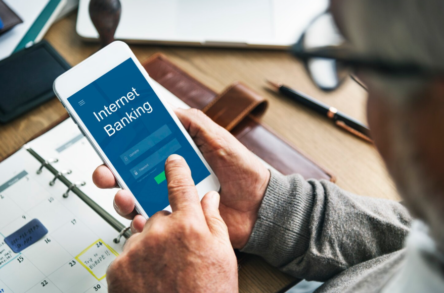 User checking mobile banking app showing what happens if bank changes policies.