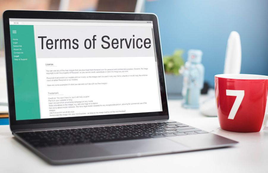 Laptop showing a terms of service update explaining changes to user rights and access.