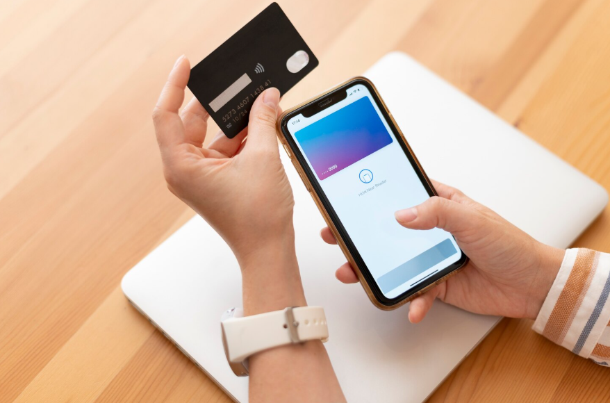 User reviewing a credit card benefits change on a mobile banking app.