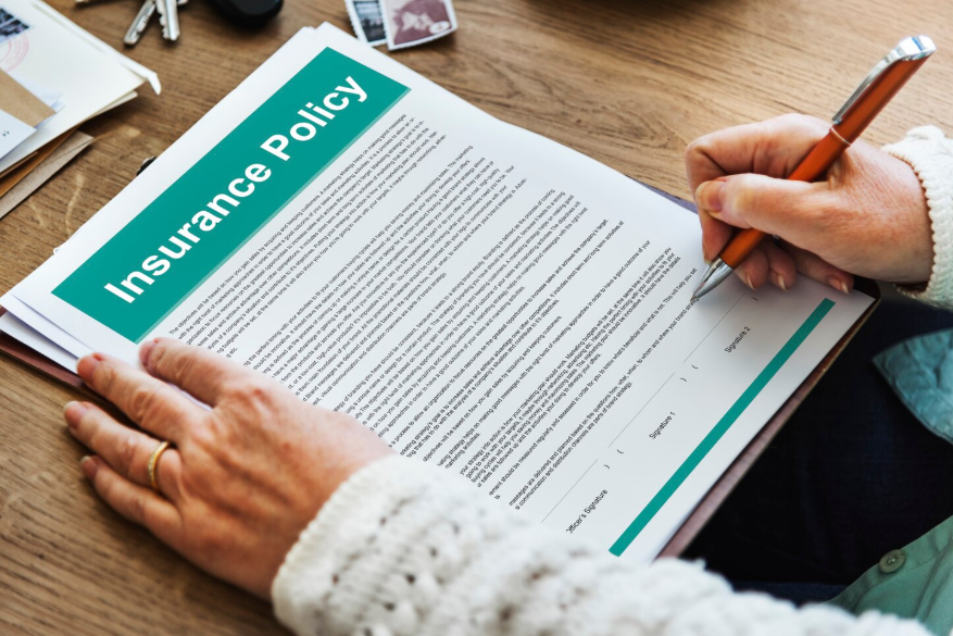 Person reviewing a policy after an insurance plan discontinued notice.